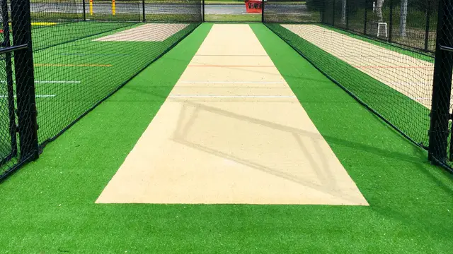 Beige cricket wicket surface