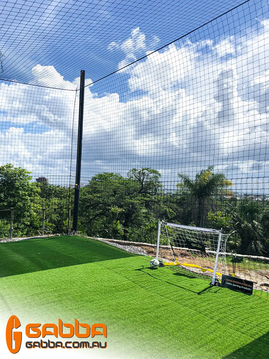 Outdoor futsal court with enclosure netting and goal